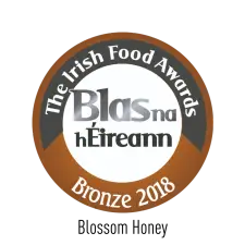 A circular badge reading "The Irish Food Awards, Blas na hÉireann, Bronze 2018" with bronze, white, and black sections.
