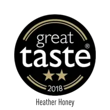 A black circular badge with gold and white text reads "great taste 2018" and features two gold stars underneath the word "taste.
